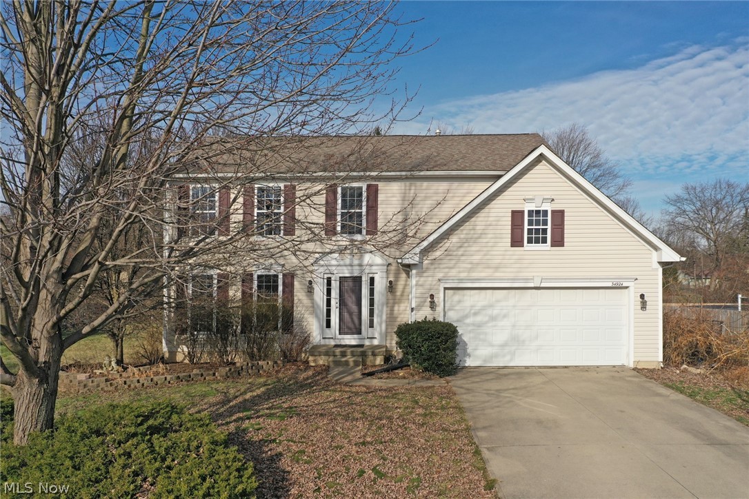 Welcome home to this spacious colonial in the highly sought after Wildwood Estates! Live in this lovely neighborhood without having to succumb to HOA fees and the rules that come along with them. This home offers a comfortable layout on each of the three stories. The upstairs boasts three roomy bedrooms plus an Over-sized Owner's Suite with walk-in closet and attached generous private bath which includes a Jacuzzi tub and separate shower! There is another full bathroom upstairs along with a half bath on the main level. The main floor also hosts a bonus flex space, laundry room, living room & functional eat-in kitchen with attached dining room. The sliding glass doors off the kitchen lead to the back yard with perennial plants that surround a paver patio. There is a lot of potential in the 1/3 acre yard for you to create a place you look forward to spending time - once the weather breaks that is! The basement has some framing and electrical work done but it is still unfinished and is aw