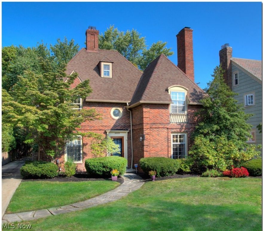 Welcome home to this pristine and elegantly updated brick French Normandy in the heart of Shaker Heights. From the moment you step in the door you will find charm and character seamlessly blended with new and fresh finishes. The kitchen is a chef's dream with top of the line appliances, custom Maple cabinets, sparkling granite counters and recessed lighting. The expansive first floor also boasts formal living and dining rooms, and an office with built-in-bookshelves. The family room style offers a Frank Lloyd Wright-like feel with two full walls of crystal clear windows that adjoin providing a lush, picturesque lookout to a green patio. Head up to the second floor where you will find a beautifully update bathroom, three bedrooms including the master with its own updated bath and walk-in closet that is sure to please any homeowner. Continue up to the third floor guest suite and another full bath. The basement is perfect for a rec room or teen space and also has plenty of room for storag
