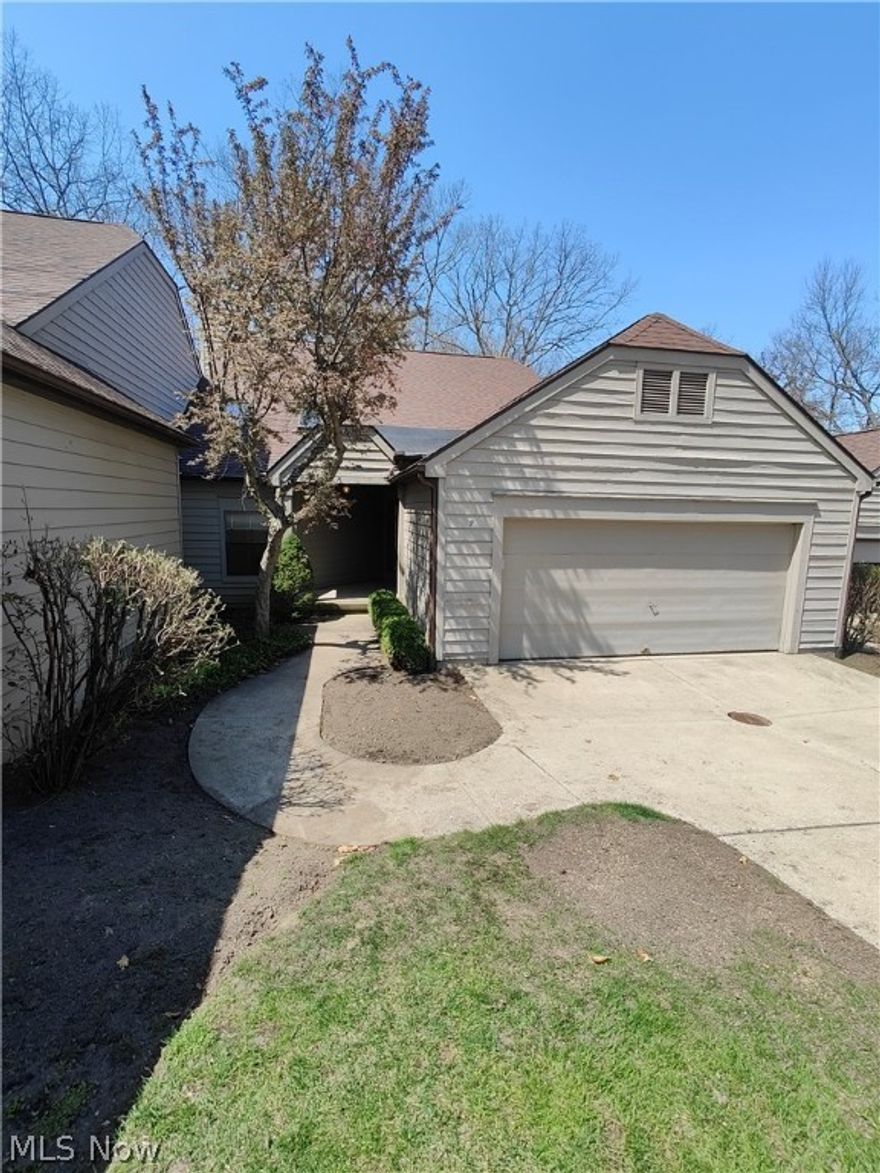 Check out this condo with a TON of potential in Green!  The open and modern first level features vaulted ceilings,  a massive master suite w/full bath and walk-in closet, formal dining space, eat-in kitchen, laundry room, half bath, and great room w/ gas fireplace. Spectacular golf course views from the deck which is accessed from the great room. Head downstairs to another living space, full bathroom, large 2nd bedroom, unfinished storage area, and access to patio below the deck. Schedule your private showing today!