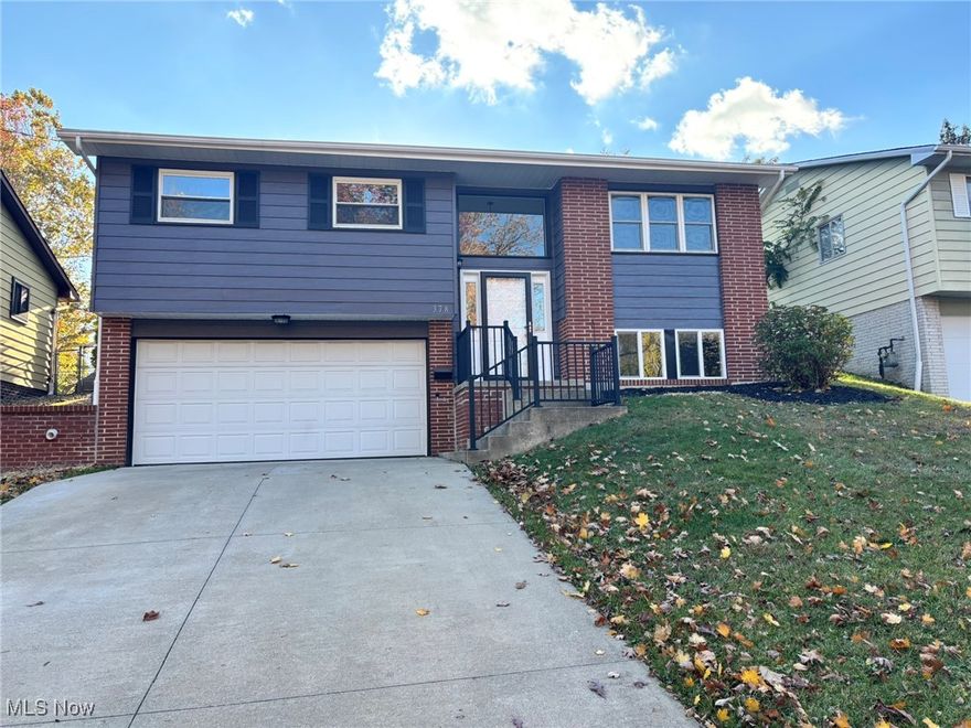 This beautifully renovated 3-bedroom, 1¾-bath bi-level home near downtown Bedford offers modern comfort and convenience just minutes from shopping and I-271. The exterior showcases a new architectural shingle roof, newer windows, and fresh paint with stylish brick accents. A spacious two-car garage with electric opener provides ample parking, while the fully fenced backyard includes a concrete-floor shed—ideal for storing lawn equipment and seasonal furniture. Inside, the remodeled kitchen and dining area feature quartz countertops, a stainless steel sink with garbage disposal, black faucet with soap dispenser, and luxury vinyl plank flooring. New white cabinetry with black hardware complements the suite of stainless steel appliances, including a gas range (with optional electric hookup), dishwasher, microwave, and French door refrigerator with ice maker. The carpeted living room offers a cozy retreat, and sliding doors lead to a covered patio with screens for year-round enjoyment. The main bathroom has been stylishly updated with a new tub, tiled walls, glass corner shelves, black mixing valve, rainfall showerhead with handheld, and durable vinyl plank flooring. New cabinetry with soft-close drawers, a hard-surface countertop, and matching fixtures complete the space. Fresh carpeting extends through the living room, hallway, and bedrooms, each with generous closet space and freshly painted trim. The home also features an upgraded electrical panel, new outlets and switches, and LED lighting throughout. Comfort is ensured with a newer A/C unit (2021), forced-air gas furnace, and brand-new hot water tank. The finished lower level adds living space with vinyl plank flooring, fresh paint, and a laundry area equipped with a new tub and electric dryer hookup. A waterproofing system and new sump pump enhance peace of mind. The lower-level ¾ bath includes a tiled shower, oversized shelf, black fixtures, and rainfall showerhead with handheld.