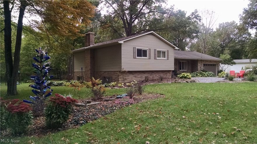 Fantastic 2376 Sq. Ft. home surrounded gorgeous landscaping, Dynamic Kitchen That Opens Out To Huge Deck and Beautiful Views .4 bedroom 2 1/2 baths. Great room features a fireplace. Roof is only 3 years old, newer water heater, newer softner with carbon filter and chlorinator, aeration pump is 3 years old and newer woodburner.  Fenced pasture area. 20x15 heated building.  Call today for your private tour!