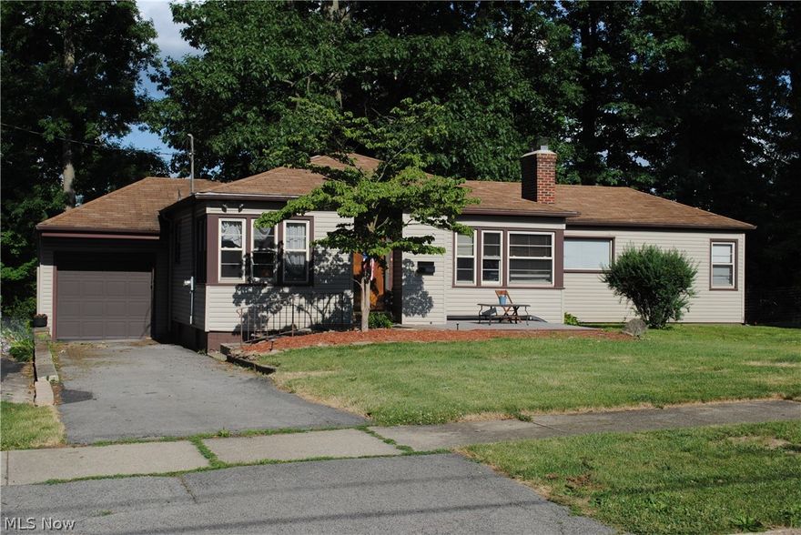 Three bedroom ranch with vinyl siding and replacement windows. Nice updated kitchen with appliances. Hardwood or laminate floors in most ares. Property has a extra driveway for parking and a large fenced shaded backyard for great outdoor entertaining and play area.