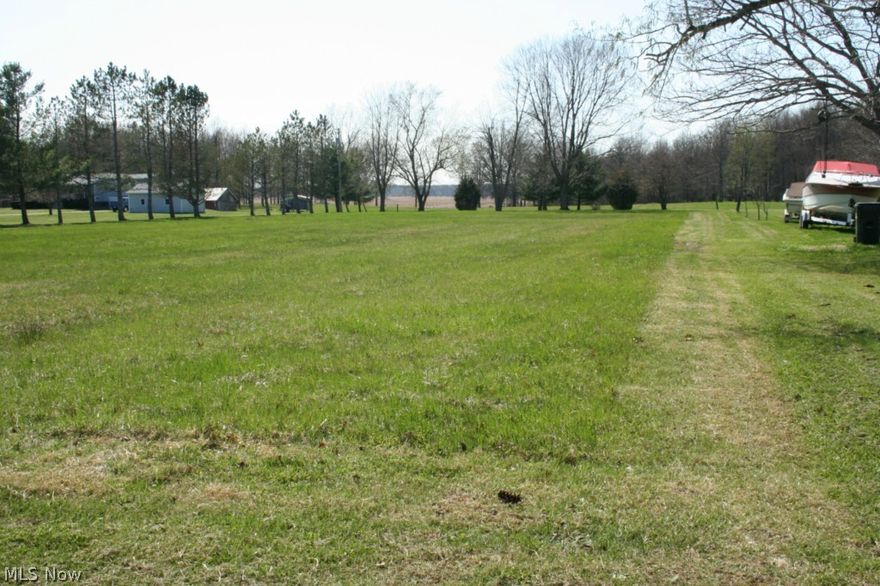 Eaton Township 5 acre building lot. Bring your builder! Water tap is already installed. Some trees on lot. House and 5 acres to the south of this lot are also available, with an additional 5 acres south of house parcel available as well.