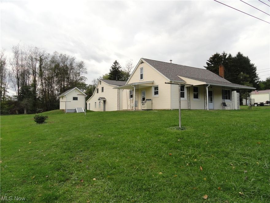 4 BR, 1.5 Story home on nice lot features an eat in kitchen, main floor laundry & main fl Master BR.  Update in 2015 include:  vinyl replacement windows, Wayne garage doors, 200 amp service, carpet in LR & stairs, new siding, roof & gutters on house and garages.  New AC & Boiler.  4 car detached garage