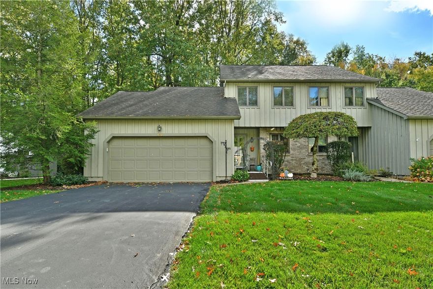 The leaves are beginning to fall, and soon you’ll be falling too, in love with this stunning Cortland condo! Serving up two floors of comfortably cozy living space, this three-bedroom residence immerses you with a scenic woodland backdrop and tasteful updates at every corner. Tucked away within a quiet local neighborhood, the home quickly excites with its handsome, naturally colored exterior; paired with warm brickwork and manicured landscaping while a mobility friendly ramp leads inside. Around the back, a prominent rear deck space stretches around to find a private patio where you can take in the views. Just past the closet lined foyer, carpeted stairs rise away near a colorfully appointed half bath. The sunken living room steals away with tall, skylight adorned ceilings that shine down past the loft overlook.  Opposite the foyer, sun washed dining joins the galley-style kitchen and its long running countertops. The family room ties it back together with continued, hardwood style flooring. Completing the level, a breathtaking sunroom is currently configured as a unique fourth bedroom. Upstairs, the three additional rooms include the loft as they are joined by a secondary full bath. Laundry and storage can be found in the carpeted basement.
