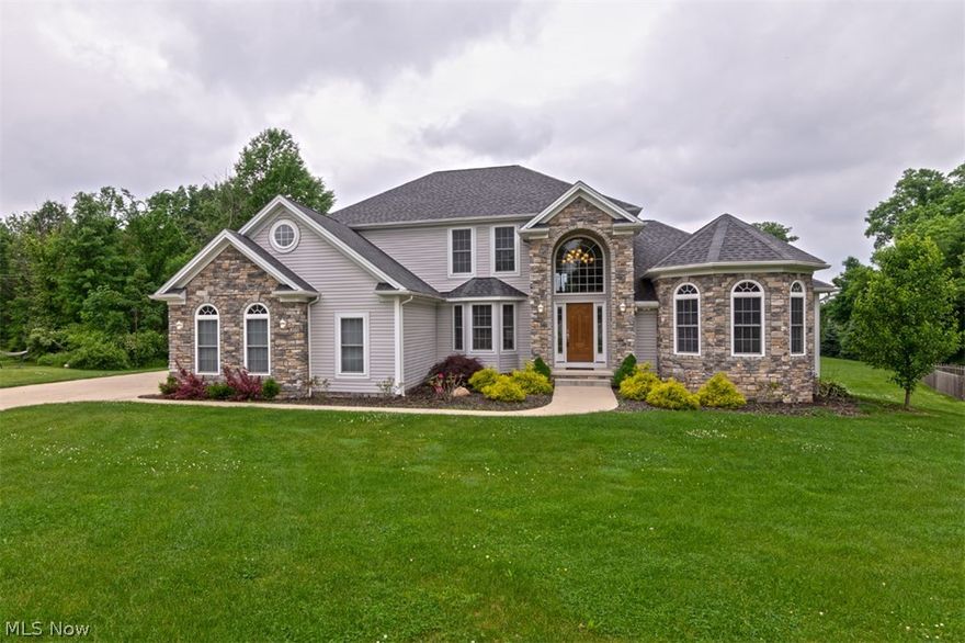 Move right in to this new construction colonial in the heart of Macedonia! With over 2,700 square feet of living space, an open, inviting layout, and a first floor master suite, all it needs is you! The two-story foyer flows into an office or bedroom to the right and the dining room with a tray ceiling to the left. You will absolutely love the expansive great room, which features a two-story fireplace and a wall of windows that frame the private backyard. The kitchen showcases stainless apps, granite counters, a breakfast bar, and a sunny eat-in area w deck access. The first floor master suite includes walk in closet and luxurious en-suite bath. Upstairs, you will find three bedrooms and a full bathroom. The walk-out lower level includes a spacious family room, a half bathroom and patio access. Outside, you will enjoy summer cookouts and gatherings on the back deck and patio, and the yard is over one acre, great for children or pets! Located just off of Valley View Road in Macedonia, t