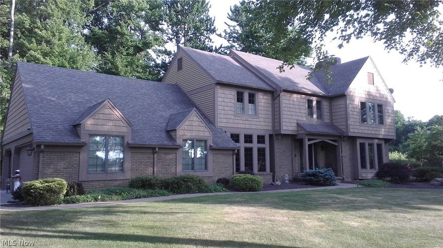 Take off Your Shoes and come on in!  Beautiful “Tudor-styled” colonial on desirable Foxden Dr.  Living room with marble fireplace,   Formal dining and dinette all opening to your fantastic kitchen.   Over-sized master bedroom with fireplace and balcony.   First floor office and laundry.  Finished basement with bar area and workout room.  United Local Schools.  Priced to sell at $339,500. Garages for 4 ½ cars!
