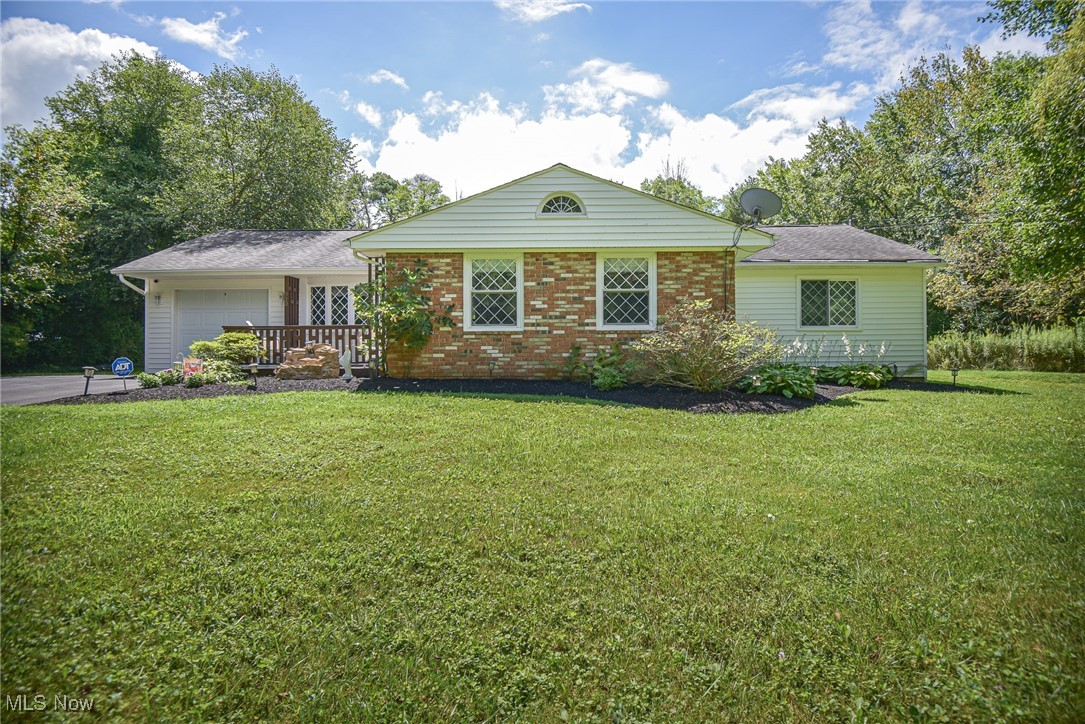 Welcome to 920 Marwin Dr, a charming 3-bedroom ranch nestled on nearly half an acre in Hinckley Township, within the Highland Local School District. From the moment you arrive, the inviting front porch sets the tone for the comfort and character you’ll find inside. Step through the front door into an open-concept living and dining room, where the living room features a sliding glass door with views and access to the side yard, and the dining room is highlighted by a beautiful bay window that fills the space with natural light. The layout flows seamlessly into the kitchen, which offers a breakfast bar, generous cabinet and counter space, a reverse osmosis system, and included appliances. A sliding glass door off the kitchen offers beautiful views and provides direct access to the expansive back deck, complete with a gazebo, making indoor-outdoor living and entertaining effortless. Tucked away in a convenient closet off the kitchen is the laundry area. The primary bedroom is a true retreat, featuring a vaulted ceiling and a sliding glass door that opens to the side yard. The second bedroom features two closets for ample storage, while the third bedroom is nicely sized, making both ideal for family, guests, or a home office. A full bath completes the bedroom wing. Notable updates include the HVAC system in 2020, driveway resealed in 2021, hot water tank in 2023, water softener and reverse osmosis in 2022, and duct cleaning in 2025. The home features an attached 1-car garage, a spacious outbuilding, and a beautiful, private, oversized lot offering endless opportunities for gardening, play, or simply soaking up the outdoors. Additionally, the home is situated just minutes from Hinckley Lake, where you can enjoy hiking, kayaking, fishing, and all that the Metroparks have to offer.