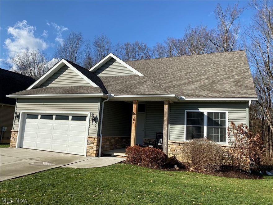 Easy living! Located directly across from the Ohio Canal and Towpath is this beautifully designed three bedroom, 2 full bath ranch style home. The great room has 12 foot ceiling. Beautiful wall of windows surrounding the gas fireplace overlooking a gorgeous wooded lot. The kitchen is a chef's delight with self closing Kraftmaid cabinets, hardware and all Frigidaire Professional appliances. There is a huge deck off dining room. The large owners suite has tray ceiling, gas fireplace, en suite bathroom with double sinks with granite countertops, soaking tub, separate shower stall and walk in closet. First floor laundry and half bath with granite countertop. The finished walk out basement has so much to offer. Large family room area, a theater room (4k 3D projector and screen stay), a hobby room, a wood shop, a half bath, and still plenty of storage. Fulton Landing community includes an HOA of $165 a month which covers your mowing, landscaping, snow removal, and trash services. Call today