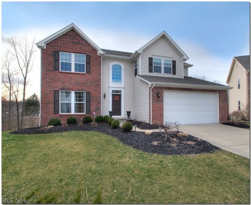 Terrific brick front colonial in Canyon Springs! Soft neutral decor throughout with plush carpeting & hardwood flooring in the kitchen. Gracious formal dining room is ideal for entertaining and the great room has a cozy fireplace & adjoining den.  The chef's kitchen has GE stainless steel appliances, a reach-in pantry, center island & casual dining area with a door leading to the deck.  Upstairs, the spacious master suite has a pampering bath & walk-in closet and three additional bedrooms share the hall bath.  Offering additional living space & ideal for game room or theatre, the walkout lower level leads to the private wooded yard and plenty of storage is found here as well.