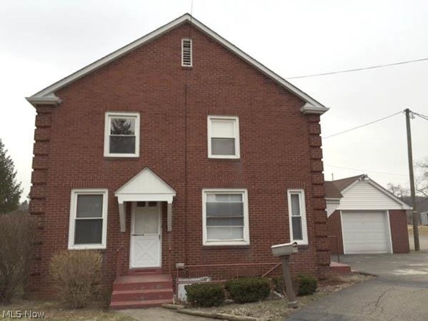 property includes brick home, large parking lot, and large brick building formally used as Fairpoint Catholic church and rectory