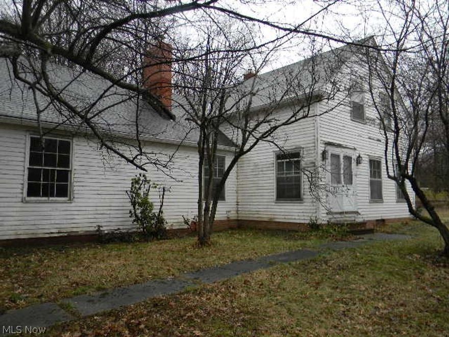 This is a Fannie Mae Homepath property. 4 bedroom, 4 fireplaces, 2 1/2 bath home 1.66 acres. Attached 2 car garage, screened in porch, big basement, corner lot and driveway access on both roads.  Approximately 10 minutes to shopping, dining and direct freeway access to downtown Cleveland.