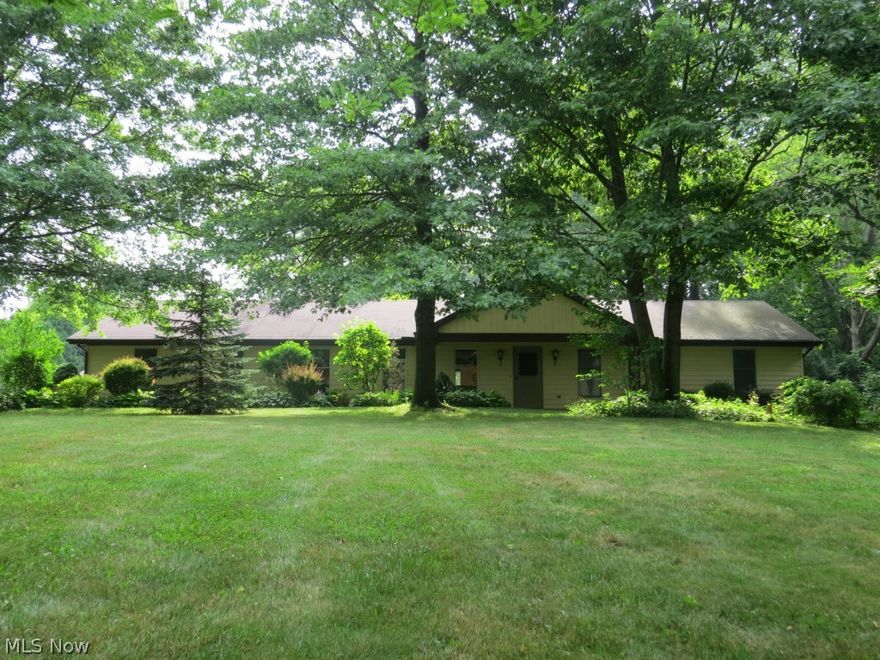 Wonderful RANCH with over 2000 sq ft of living space on 3 acres! Open floor plan. 4 bedrooms, 2 full baths. Home sits 700 ft off street with winding paved driveway which makes it a private retreat! 2 car attached garage and a 2+ car detached garage. Pond on property. Inviting covered front porch and brick patio in backyard offers more places to sit and enjoy the nature around you. Kitchen with ample counter and cupboard space. Charming wood burning stove in family room is great for cooler nights. Laundry room with a complete butler's pantry including floor to ceiling cabinetry, counter space and an additional stove. 4 good sized bedrooms, Jack and Jill bathroom between 2 bedrooms. Double sinks and skylight in other full bathroom with separate door to master bedroom. Master bedroom is large with divided (his and hers) walk in closet area and sliding door to back patio. Fenced in pasture area could be great for horses. Updates include: new dishwasher, stove, garbage disposal and laminate