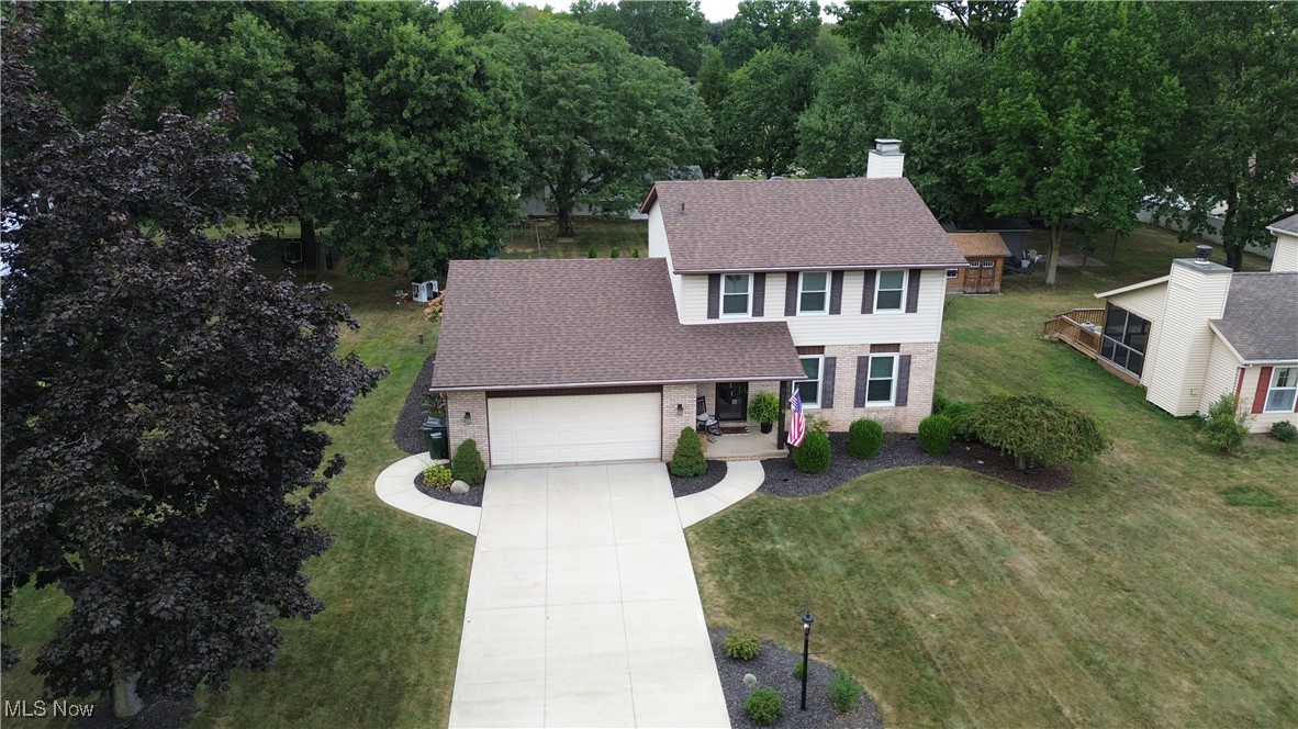 Visit this updated and well maintained home in Jackson School District that you will want to see. Drive into the new concrete driveway and new walk ways-2019. Look up and you will see the new roof that was just put on in 2024. Enter the front door and you are greeted by the Living Room with its new windows 2020. As you walk down the hall toward the back of the home you will discover a half bath that was just updated. The two upstairs full baths were also updated in 2025 with new quartz countertops, new hardware, new toilets, and painted or wallpapered. As you arrive at the back of the house you will find an open room with a Kitchen, Dining Room, and Family Room completely in view. The family Room has a well maintained wood burning fireplace, new built-in bookshelves 2020, and new carpet 2024. The Dining Room is open to the other two rooms and has a slider to the backyard. The kitchen has all new appliances 2024 and freshly painted cabinets 2020. The Kitchen also boasts new countertops, backsplash, and sink 2024. You will also find an island with seating and a large pantry. Off the the Kitchen is the garage with new garage door motor, sensors, and outside keypad 2023. The garage floor just had an epoxy floor finish 2025 and a full garage paint job. The three bedrooms and two bathrooms are updated with paint and new hardware and toilets 2025. The basement is open and ready for you to make it your own. In 2025 the backyard had a makeover. 24 x 24 feet of stamped concrete was poured, a gas fire pit was installed, and the backyard was landscaped. What a great relaxing back patio. Come visit this open floor plan with a wonderful backyard.