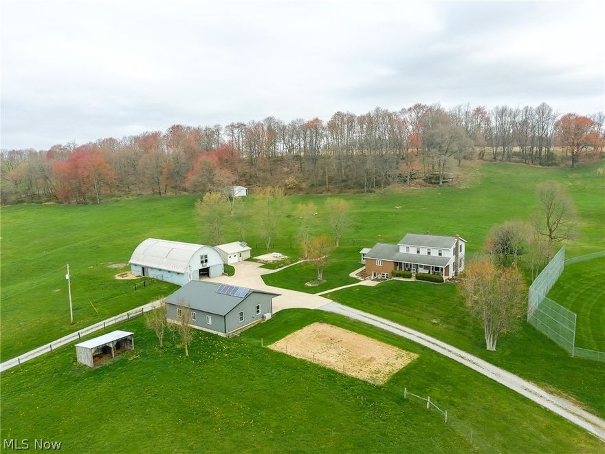 Property to be sold at Onsite Auction: Wednesday, May 15th at 6:00 PM. 11.8 Acres with 2 driveway access points. This expansive 2-story home offers abundant space and functionality. The main floor welcomes you with a large living room, seamlessly connected to the dining room and a well-appointed kitchen featuring custom birch cabinets, an eat-in island, and a sizable pantry. Adjacent to the kitchen is an unfinished sun porch, perfect for enjoying the outdoors from the comfort of home. Two bedrooms and a shared bathroom complete the main level. Upstairs, you'll find three additional bedrooms, another bathroom, and a generously sized open area ideal for a recreational room. The basement, accessible via two outside entrances, boasts ample open storage, a root cellar, a third bathroom, a laundry area, and a summer kitchen. Utilities include NG heat, private septic, and water sourced from a natural spring. Outside, a 34'x44' heated shop with a 6' overhang features a solar array with battery backup, inverter, and NG backup generator equipped with a new 2023 engine. A 34' x 60' lofted barn offers three stalls, a tack room, and ample hay storage, while the spacious pasture provides plenty of grazing space for animals. Additionally, a 24' x 24' pole shed offers even more storage options.
Additionally, there is a operating ballfield with dirt infield. 24’ x 100’ pavilion with concessions that includes NG stove and fridge. All picnic tables and playset will go with the sale.