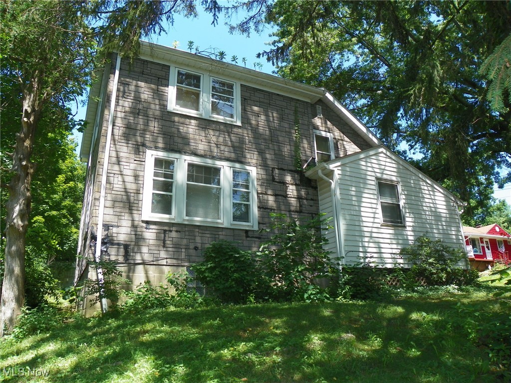Cape Cod with 3 (possibly 4) Bedrooms and 2-1/2 Baths * Located on a large (almost) 1/2 acre lot on a quiet secluded street * This home is very unique as the owner created many customized features in the home * On the first floor you'll find a spacious and cozy Family Room with a decorative fireplace and hardwood floors * Eat in Kitchen with built in appliances and cute built ins in the nook area * A huge Dining Room space with hardwood floors * An office/bedroom that has a sink and plumbing for a toilet (previously used as a bedroom/bathroom for an elderly person), now has a built in desk in it to be used for an office (this room has baseboard heat) * Off the back of the house you'll find a mudroom area with a freezer and a Full Bathroom off the Kitchen that has washer/dryer hookups and a walk in shower * On the second floor you'll find another Full Bathroom off the hallway and 3/4 Bedrooms * A few Bedrooms are regular Bedrooms, however, the others are quite different with another Bedroom off of the one with a built in bed set up and the one towards the back of the home has another room off of it (could be a play room, sitting room etc.) * The Basement has glass block windows, updated electrical boxes, sump pump and a newer HWT (2011) * The roof (complete tear off) was done in the last 9-10 years * In the back of the wooded/treed yard you can find pear trees and raspberry and blackberry bushes * This home is located in a great area, close to Garfield Metro Parks and Tinkers Creek * Seller will make no repairs and Buyers to assume POS violations * With a little updating and TLC this home can become a house again !