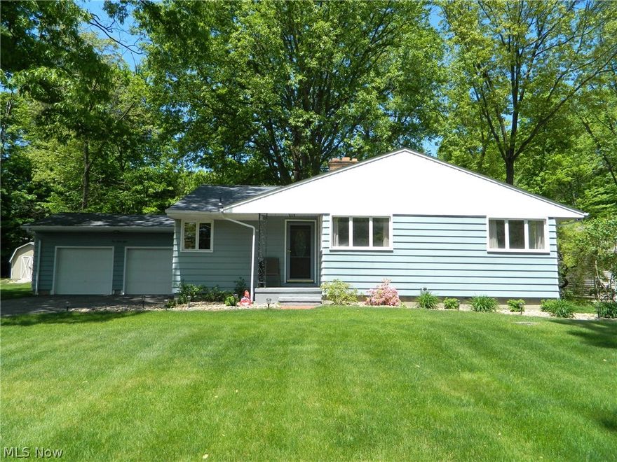 Beautiful, sprawling 1400 square feet 3-bedroom Ranch with park-like setting! New carpeting, freshly painted interior, new oven, and drop ceiling garage. Open floorplan with large living room, with double sided gas fireplace and combined dining room. Nice hardwood floors - large family room offers Amelco windows - which are curved at the bottom and offer blinds in between double panes of glass! Kitchen with eat-in bar area and all appliances stay! Newly landscaped! A must see!