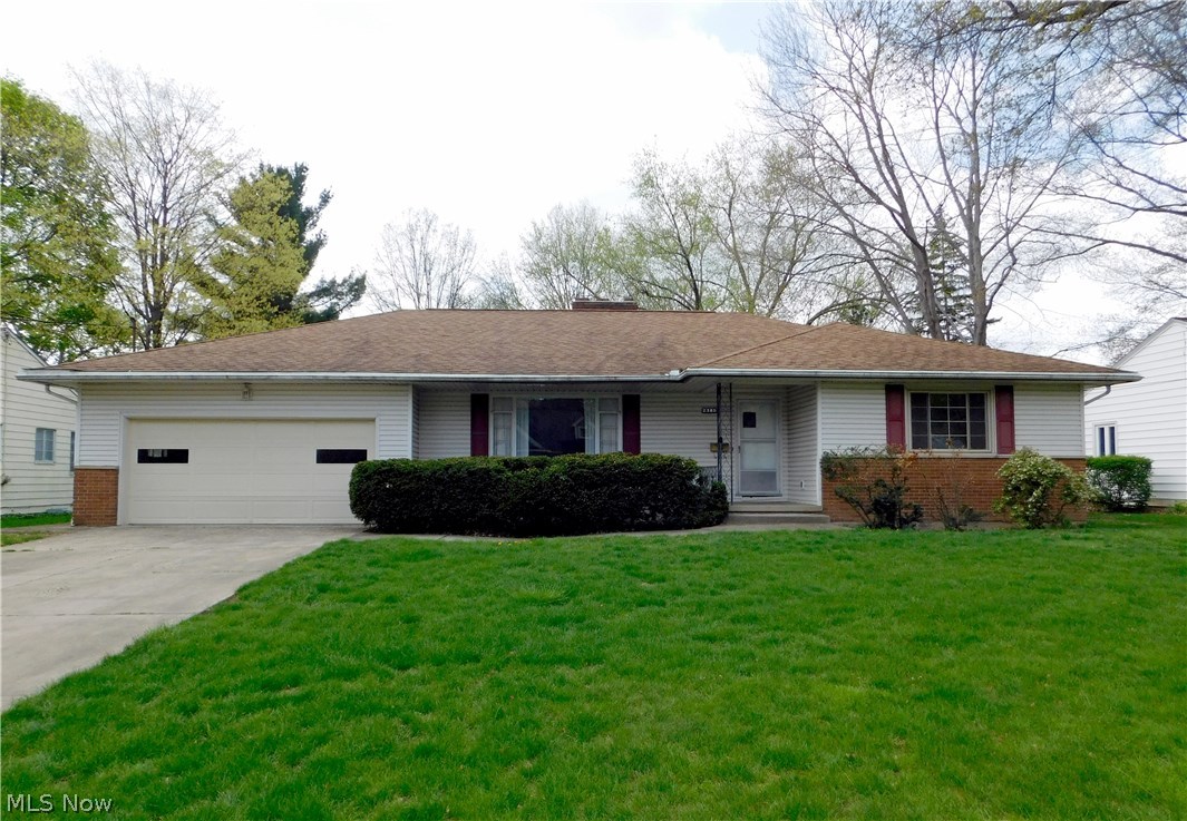 Loads of potential in this large 3 bedroom, 2 1/2 bath, ranch home with over 1800 sq feet of living space in West Akron. Formal foyer, expansive living room with large wood burning fireplace, open to the formal dining room that leads to the screened porch and to the galley kitchen with pantry, eat-in dining and half bath and is great for entertaining. 2 Spacious bedrooms with nicely sized closets, full bath and a large master suite with double closets and attached full bath for owner privacy. The sizable basement features a finished knotty pine rec room with bar area, 2nd wood burning fireplace with even more space for workshop and storage. Attached 2 Car garage with lovely treed, shaded private backyard perfect for any number of activities and hobbies. BONUS INFO: New furnace install 12/16 and there are hardwood floors underneath the carpeting. This home is very convenient to shopping, schools, parks and area recreation. Make this your dream come true, call today for your private show