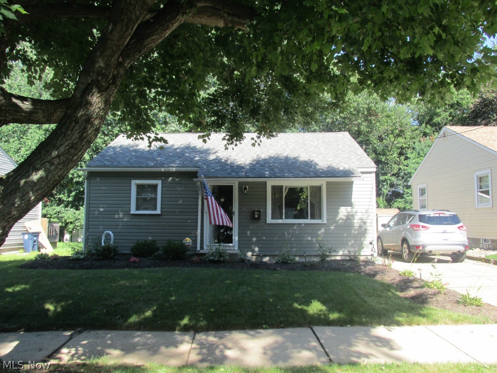 Completely Updated Top-to-Bottom in 2009 with more recent improvements. Beautiful wood floorings in kitchen, living, bath and hallways for easy-care living. Very nice knock-down textured ceilings. Concrete drive, one care garage has new door opener, glass block windows and workbench. Wood privacy fenced backyard for outdoor entertaining plus 16x16 paver-block patio on level 50 x 140 lot. Efficient low utilities makes this home a great find. Appliances included refrigerator, stove, microwave, washer, dryer, central air, and security system. Curtains & blinds also included. Tastefully decorated with modern colors. Bedrooms are carpeted. Nice perennials. This home is easy to enjoy all year round.