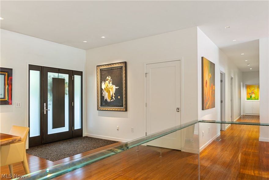 This stunning modern home features a sleek, open-concept design, offering a seamless flow between living spaces. With 3 spacious bedrooms and the possibility of a 4th, it accommodates both family living and guest hosting with ease. The interior is filled with hidden surprises, including innovative storage solutions, built-in smart home technology, and unique architectural details that add charm and functionality. Imagine having everything you need neatly hidden behind sleek, custom-designed doors. Integrate your refrigerator and freezer behind custom white door cabinetry that blends seamlessly with the rest of your kitchen, coffee bar, toaster and other small appliances. The walk-out lower level is an entertainers delight featuring a recreation room with an unparalleled bar perfect for gatherings, a sleek media wall with projector can transform your space into a modern entertainment hub. The full bath is remodeled to perfection, boasting heated floors, a unique heated guitar towel holder, and designed custom stone shower. Sliding doors open to an inviting outdoor space with full kitchen, fireplace, and more, making you feel like you’re on vacation every day. The outdoor space is a true sanctuary, featuring a beautifully designed koi pond, with imported fish, and a cascading waterfall that create a serene ambiance, along with the sauna and hot tub. The landscaping is meticulously maintained, offering a unique variety of lush plants and flowers that enhance the beauty of the property. This home is not just a place to live but a lifestyle to be experienced, with every detail crafted to make you fall in love.  So many details to this amazing home that words cannot describe.