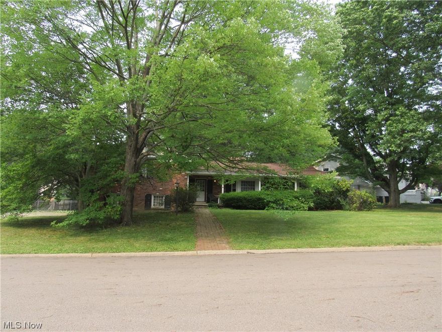 What a fantastic opportunity to get into a beautiful neighborhood at an affordable price! The unique 4-level split floor plan on a corner lot offers lots of space to grow! When you enter through the front door into the foyer, you'll step down into the spacious living room to the right (with bay window and charming fireplace w/ built-ins). Step back up to a large dining room w/ another bay window. In the kitchen (towards the rear of the home), you'll fihd a large eating area w/ another fireplace, loads of kitchen cabinets w/ hard surface counters. Off of the kitchen, you'll find a sunroom w/ newer windows that leads to the fenced in backyard. The lower level offers a family room w/ walk out and a half bath. Upstairs, there is a large primary bedroom w/ double closets, hardwood floors and an en-suite bathroom w/ double sinks and shower. Another bathroom is in the hallway for the other two bedrooms. Home warranty being offered for the new buyers.