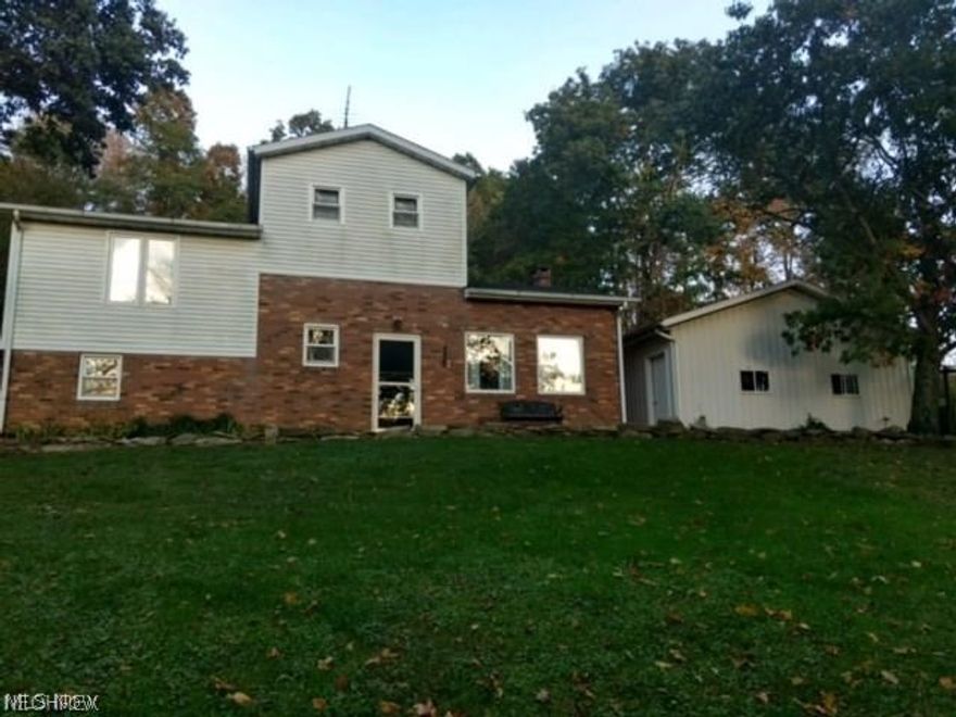 4 Story split level home situated on 7 1/2 acres!  Located off a township road this 3 bedroom 1 bath home has multiple uses.   As you will see when you pull in the driveway - you will reach a detached workshop (heated/air/electric/water) - as well as a large 2 car detached garage.  Enjoy  many plants/flowers.  Spring water (well also available) Fenced in pasture  - Log wood burning furnace - upper level living room with plenty of light for indoor flowers and dining room space and a large kitchen on the second floor.  Country living/hunting on this 7 1/2 acres.  Priced to sell!