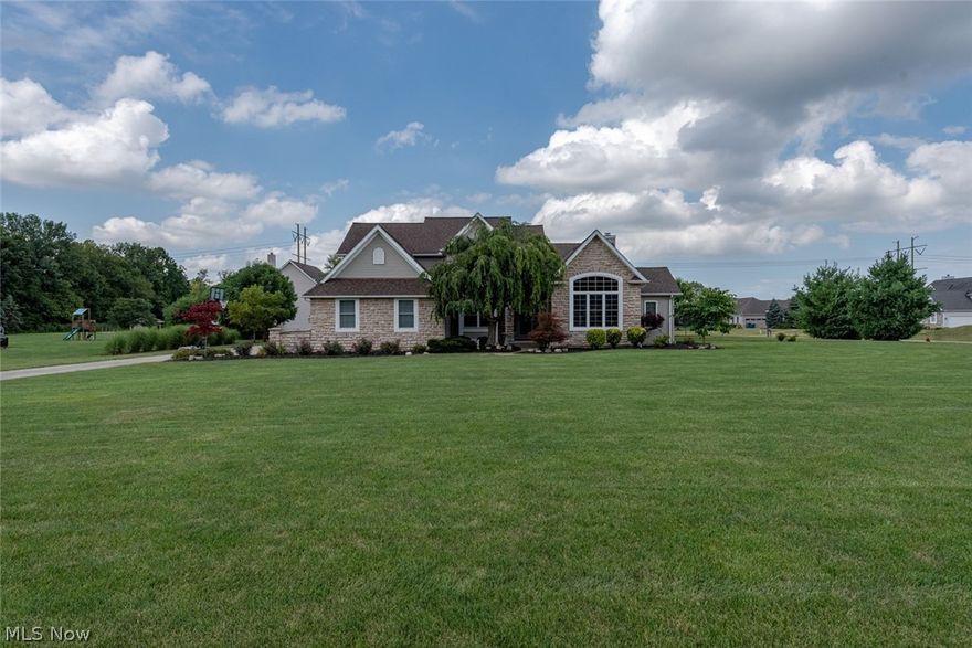 Situated on a beautifully landscaped 1 acre lot in Columbia Station, this stunning colonial leaves nothing to be desired! This home features a gorgeous eat-in kitchen, a lovely master suite, and a brick patio that overlooks the serene backyard. All that is missing is you! The living room features vaulted ceilings and a cozy stone fireplace. Off of the living room, there is a bedroom suite that is currently set up as a family room. The kitchen boasts granite counters, stainless steel appliances, a breakfast bar, and a sunny eat-in area with patio access. The formal dining room, a laundry room, and a half bath complete the first floor. Upstairs, you will find three spacious bedrooms, including the master suite which features a beautiful en suite bath with double sinks, a soaking tub, and a step-in shower. An additional full bath rounds off the second floor. The finished lower level is built for entertaining, featuring a rec room, a bar, a home theater, and a bonus room perfect for an off