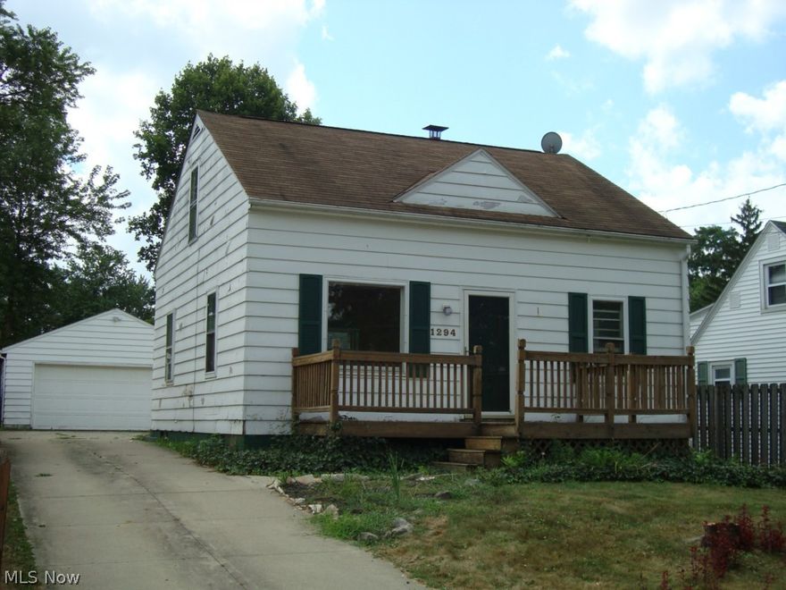 This home is a  fixer upper in need of handyman.  Three bedroom Cape, natural hardwood flooring throughout, Eat in kitchen, central air,  front and back decks, Large 2 car detached garage.  Located in the Johnson's Corners area of Barberton.