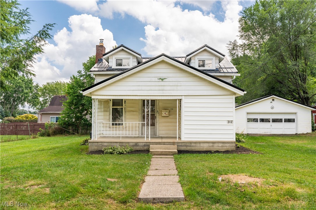 Welcome to this beautifully updated bungalow, offering over 1,000 sq. ft. of bright and inviting living space on an oversized lot. A covered front porch welcomes you inside, where the sun-filled living room features under-stair storage and flows seamlessly into the formal dining room. Warm wood paneling adds a cozy touch, and access to the covered back patio, perfect for outdoor dining or relaxing by the fire pit in the backyard. The updated eat-in kitchen is both functional and stylish, featuring white cabinetry, a classic subway tile backsplash, and peaceful views of the backyard. The main-floor primary bedroom offers two closets and a private full bath with a tub/shower combo and a linen closet for extra storage. Upstairs, you’ll find 2 bedrooms, along with a second full bath. The unfinished basement offers a shower, sink, laundry area, and plenty of room for storage or a future workshop. A detached 2-car garage with a built-in workbench completes this fantastic home. Recent updates include a metal roof, toilets, vanities, kitchen cabinets, windows, furnace, AC, hot water tank, fresh paint, new garage door opener, and updated plumbing. Don’t miss your chance—schedule your private showing today!