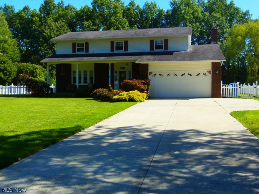 This Beautiful Remodeled Colonial Sits Over 1/2 of an Acre at the End of a Quiet Cul-de-Sac and Features New Carpeting and Painting throughout the house (12/14), 4 Bedrooms, 2.5 Baths, a Gorgeous Remodeled Kitchen with Ceramic Tile Flooring, Granite Counters and a Custom Tin Backsplash, the Family Room Features a Fireplace New Ceramic Tile and a Pella Door that Leads Out to a 20x20 Patio in the Large Vinyl Fenced Backyard that Includes a New 2+ Car Garage with a Workshop, Double Garage Door, Man Door and Metal Roof, there is also an Additional Storage Shed, the Master Bedroom has a Walk-In Closet, a Vanity and Full Bath, New Energy Efficient HVAC, Newer H2O Tank, Newer Driveway with an Extra Concrete Pad Perfect for a Boat/RV, Newer Vinyl Double Hung Windows, this Home Offers Ample Storage with Large Closets, a Full Basement and 2 Attics. Have No Worries - Basement Waterproofing and Drainage was Completed in 10/2014 with a Transferable Warranty. This Home is Situated in a Park-Like Set