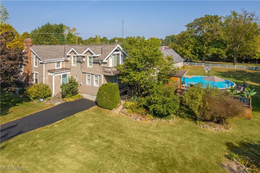 Welcome to your private retreat!
This beautifully updated 4-bedroom, 3-bathroom home offers the perfect blend of comfort, style, and entertainment—both inside and out.

Step inside to find a fully remodeled kitchen with modern finishes with tons of cabinet space, granite counter tops, stainless appliances and a huge island, the kitchen is perfectly finished off with a custom slate floor. Enjoy the large living room with it's brick fireplace on those long winter days the first floor is finished out with a spacious first-floor master suite complete with walk-in closet and spa-like bathroom, head up stairs for a second a cozy family room featuring its own wet bar vaulted ceilings and balcony. 3 guest bedrooms finish out the second floor. Large windows throughout fill the home with natural light, all recently replaced, add in the new roof for efficiency and your peace of mind.

Outdoors, the property is an entertainer’s dream. Enjoy a covered pavilion with a gas fireplace, and a pool with a natural gas heater and poolside deck and it's very own tiki bar!—perfect for summer fun or quiet evenings by the fire. An outdoor wet bar with electrical service makes hosting effortless, while two additional outbuildings provide plenty of storage and work spaces.

Sitting on almost an acre, this home truly has it all—space, upgrades, and endless opportunities to relax or entertain. Don’t miss your chance to own this exceptional property!