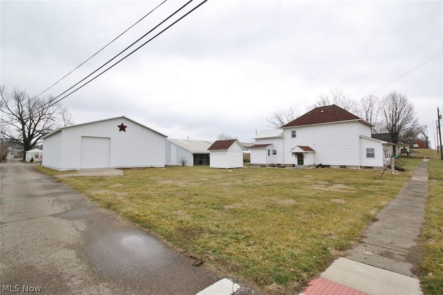 Spacious home with over 2200 sq. ft including multiple outbuildings!  Large 30x45 garage with over patio overhang 12x45 storage.  2006 built  40x54 pole building with 3 garage doors.  The home features nice open kitchen, upgraded 200 AMP electric service, enclosed front and back porch.  Situated on a nice level lot, this is the perfect set up for the mechanic, or those needing extra space for all their equipment and toys!  Public water is available.