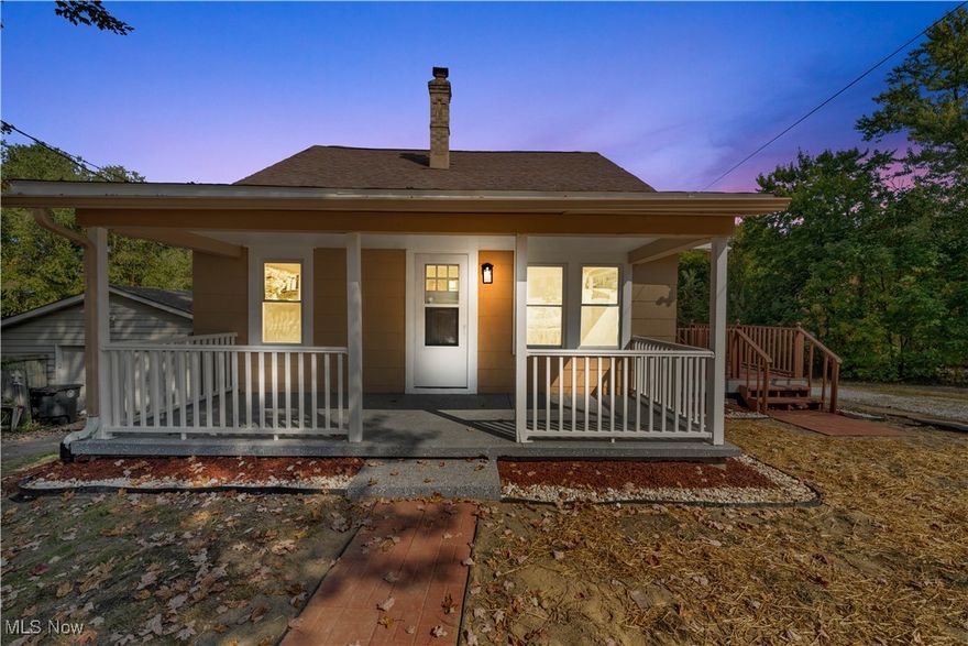 Welcome home to this thoughtfully updated, turnkey residence offering ample space, modern comforts, and convenient living both indoors and out. The entry opens to a spacious front porch and a bright living room that flows seamlessly into the dining area and updated kitchen, featuring brand-new appliances. The home includes two bedrooms on the first floor and an updated tiled full bathroom, with brand-new carpet and fresh interior paint throughout. Upstairs, a large primary bedroom awaits with two ceiling fans and a generous walk-in closet. Exterior highlights include fresh gravel driveway with extra parking in the front of the home, enhancing curb appeal and practicality, a large side deck and a front covered porch with a brand-new epoxy finish. The large flat, open backyard is ideal for enjoying time outdoors. The basement is dry, with a brand-new epoxy floor finish and a walk-out to the exterior backyard through a large commercial-grade door; it also includes a full bathroom with a walk-in shower in the lower level. A brand-new air conditioner was installed in September 2025, ensuring year-round comfort. This property offers a move-in-ready, open-concept living space perfect for entertaining and everyday living.