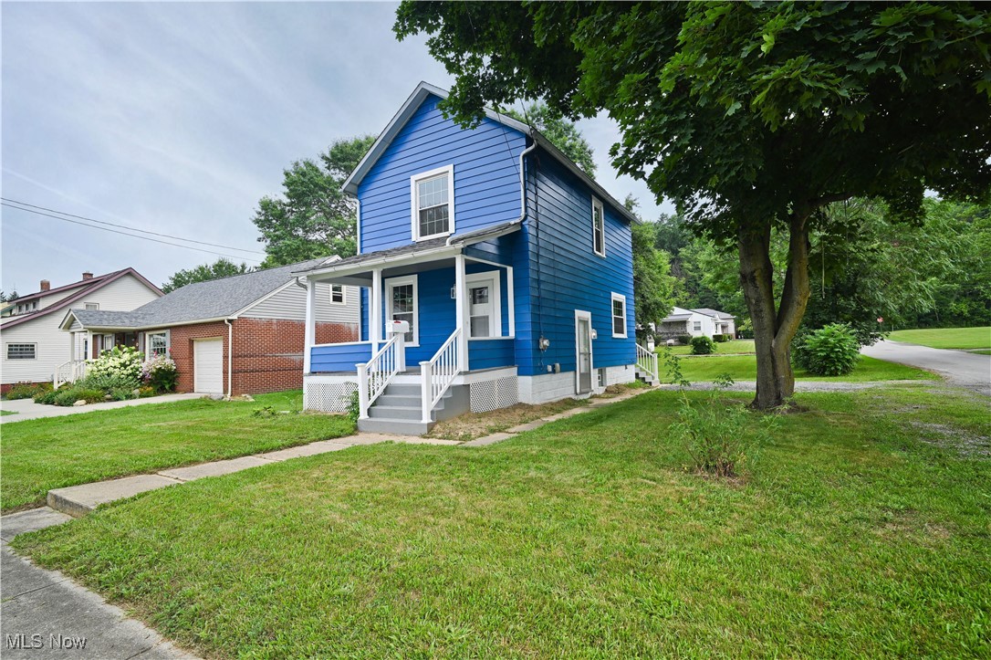 Looking for a move in ready home with great curb appeal? This well kept home has a lot to offer! Freshly painted exterior. Huge corner lot with a great backyard and two drives for extra parking. Enter in thru the back door and remove your shoes in the mudroom. Notice the modern half bath as you walk into the great kitchen and dining room. The modern kitchen comes with tons of cabinet space, new stainless appliances, great countertops, an island for quick meals. If you are looking for a home that still has all natural and unpainted woodwork and character you really will appreciate this home. The living room is spacious and there is a gorgeous wood staircase leading up to the second floor. Upstairs, there is a great sized full bath with tub shower surround, vanity and there is not only built in shelving, there is a nice linen closet for towels and bedding. Two great sized bedrooms and large lighted closets as well. The full basement has glass block windows, updated electric panel, gas forced air furnace, and there is plenty of room for the laundry set up and storage. There is a covered freshly painted front porch on this lovely home to enjoy warm summer weather. Large shed tucked on the back of the lot to store your lawn equipment and tools. Don't miss to new roof replaced this past Jan 2025! If this sounds like what you have been looking for call to schedule your showing appointment and let's see if this checks all the boxes!