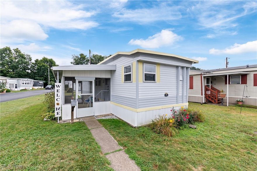 OWNER FINANCING AVAILABLE WITH A MINIMUM OF $25,000 DOWN! Welcome to this bright and comfortable home, located in a serene 55+ community, designed for easy, one-floor living! Enjoy outdoor activities on the screened porch. Step inside the bright living room, bathed in natural light from windows on all sides. The kitchen is well-appointed with ample cabinet and counterspace, and an eating area with a ceiling fan. This home features two generously sized bedrooms, each offering ample closets and storage space, perfect for keeping everything organized. The spacious full bathroom completes the living space. Enjoy relaxing mornings or evenings on the concrete patio, conveniently located off the screened porch. Recent updates include a hot water tank and a mini-split system, giving peace of mind and efficiency. This property is perfectly situated near shopping, restaurants, and expressways, making it an ideal location for both convenience and quiet living. With its bright interior, smart layout, a mix of indoor and outdoor living spaces, and low monthly lot rent of $350, this property is move-in ready and waiting for its next owner. Don’t miss the opportunity to make this affordable home your own!