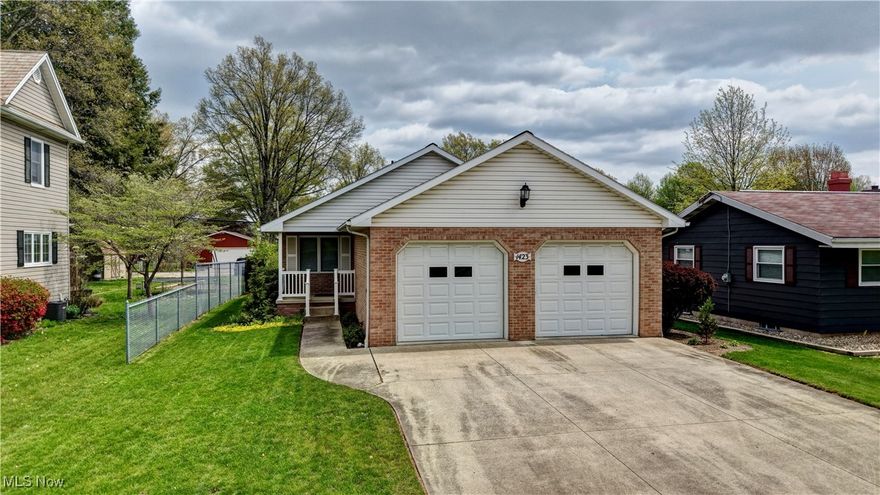Custom-built, brick 2BR, 2.5BA ranch in a prime location near schools, shopping and park. Enjoy newer flooring and fresh neutral paint throughout, plus updated recessed lighting. The open-concept layout features a family room with adjacent half-bath and spacious eat-in kitchen with custom Mullet cabinetry with abundant storage, appliances included. French doors open to a large sunroom, perfect for relaxing or entertaining. The full lower level offers high ceilings, an updated full bath, and excellent potential for additional bedrooms or a rec room. Beautifully landscaped yard, 4-car parking with an attached 2-car garage and a detached 2-car garage via alley access. Move-in ready and maintenance free, just unpack and start living!