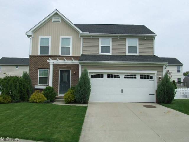 Modern Colonial on a professionally landscaped Cul-de-sac lot in Tallmadge. Open floor plan features a great room with fireplace and dining area that's open to the kitchen. The kitchen has stainless appliances and granite countertops, full pantry, and ceramic floors. Two bedrooms share a full bath, plus a nice master bedroom suite, and second floor laundry with washer and dryer that stay. All new flooring except in kitchen and main bath. Partially finished basement has a beautiful rec room or possible media room with built in projector and large screen to enjoy your favorite movies and games. Fenced back yard with stone paver patio and professional landscaping. Ready to move-in and enjoy today!