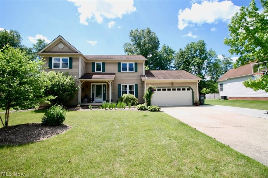 Welcome to this lovely four bedroom/two and half bath colonial home. Spacious two story foyer greets you as you enter with the living room off to your left.  Glorious open kitchen, with a new stove and microwave less than a year old and refrigerator is only two years old. The perfect kitchen for entertaining with an abundance of counter space for cooking, baking or prepping your food; cabinets galore for extra storage.  Nice easy flow to the dining room with the family room open to the kitchen and eat in kitchen area. Laundry room is also located on the main floor with storage as well for all your laundry items. Completing the first floor is a half bath with new flooring. Upstairs offers 4 bedrooms one of which is the vaulted master bedroom with master bath and huge jetted tub with a glass block wall separating the tiled shower area and tub. Recently remodeled the second full guest bath with natural light. Full sized basement is partially finished for a family, media area. Recent updat