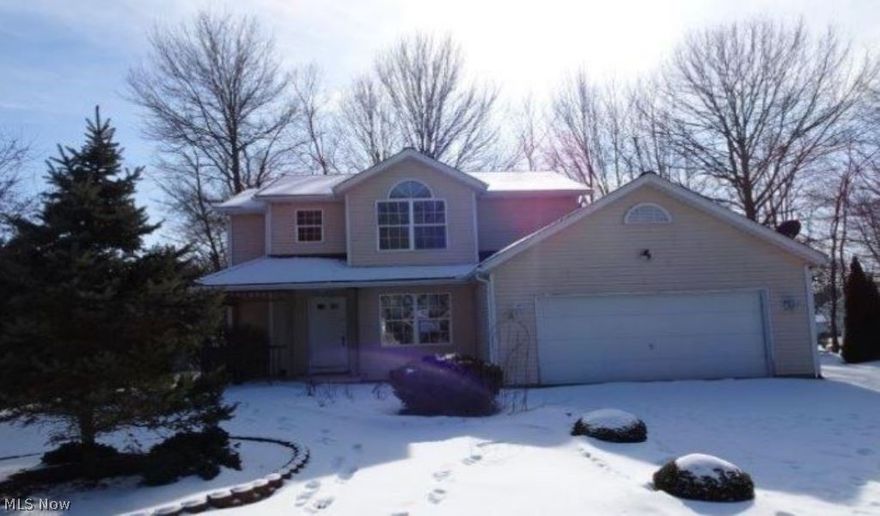 Great opportunity to own this 2-story home with vinyl siding and a wood deck in 
Garrettsville. This home offers approx. 1,715 sq. ft. of living space with 3 
bedrooms and 2.5 bathrooms, living room, dining room, family room and a finished
 basement with a bathroom. Also comes with an attached 2-car garage.