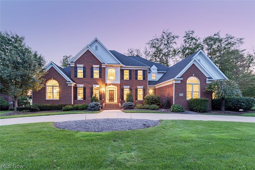 Enjoy a life of luxury in this immaculately maintained transitional home in the Barrington Golf Community. This home provides an open, inviting layout, an elegant first floor master suite, and a fabulous deck with lake views; it is just waiting for a new owner! As you step inside, you will immediately notice the gleaming hardwood floors that flow through the living and dining room. The two-story great room features a fireplace, built-ins, and a wall of windows framing the deck and golf course outside. The kitchen showcases top-of-the-line appliances including a double oven, granite countertops, and a hearth room. You will absolutely love the first floor master suite which includes a tray ceiling, walk-in closets, and a luxurious en-suite. Off of the master there is a private study/library with a fireplace. Two half bathrooms and a convenient laundry room complete the first floor. Upstairs, you will find three spacious bedrooms, each with an en-suite bathroom and a walk-in closet. The f