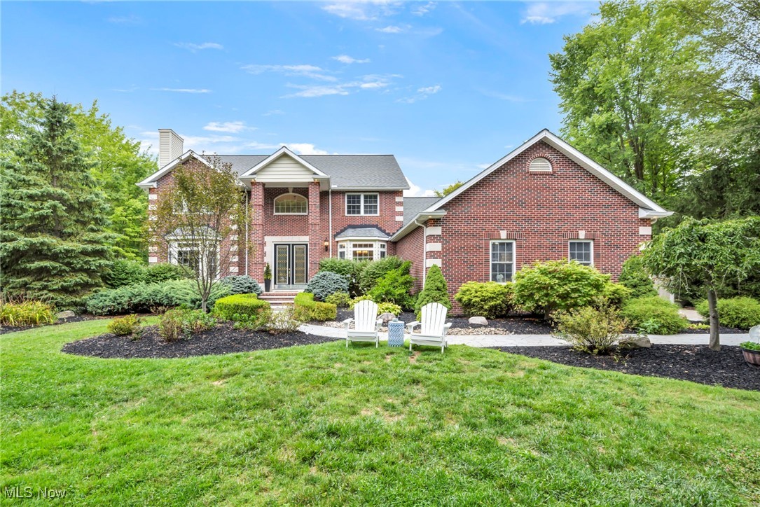 Welcome to this stunning 4-bedroom, 3.5-bath home perfectly situated on a serene 1.3-acre lot. Designed with comfort and functionality in mind, the first floor offers a bedroom and full bath—ideal for guests or multigenerational living. The spacious eat-in kitchen is a true centerpiece, featuring an abundance of cabinets, expansive counter space, a beautiful breakfast bar, and a large island perfect for meal prep. From the kitchen, step out onto the patio to enjoy picturesque views of the private backyard and unwind in the hot tub, newly added in 2022. The open-concept layout seamlessly connects the kitchen to the massive great room, complete with a cozy fireplace, while the formal dining room provides the perfect setting for gatherings. A front office with its own fireplace and seating area offers a warm and inviting workspace. The oversized first-floor laundry room is both practical and stylish, boasting extensive cabinetry and counter space. Upstairs, the incredible primary suite is a retreat in itself, featuring a fireplace, spa-like bath with a massive shower, and a spacious walk-in closet. Three additional large bedrooms complete the upper level. The expansive basement, already plumbed for a full bath and wet bar, also includes stairs leading directly to the garage. With wide 36" doors throughout, thoughtful design, and modern updates, this home is completely move-in ready—waiting for you to make it your own.