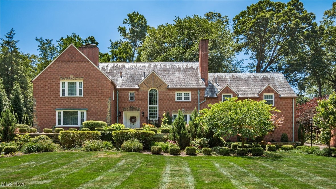 Timeless elegance and historic charm come together in this distinguished English Brick Tudor, nestled in the heart of Avondale. Boasting 6 spacious bedrooms, 3 full and 2 half baths, this residence blends period craftsmanship with thoughtful modern updates. The gourmet kitchen features custom cherry Mullet cabinetry, granite countertops, and an abundance of natural light. Rich hardwood flooring, crown molding, and a gas fireplace elevate the formal living spaces, including a refined dining room and a library/study with built-ins and a second fireplace.
The second floor offers a gracious primary suite with a private foyer entry, full bath, and double-door closet, along with five additional bedrooms and a conveniently located laundry room. The finished lower level includes a rec room and theater room—perfect for entertaining. Outside, the home is surrounded by mature landscaping, a covered brick patio, and brick soffits that enhance its architectural integrity. A 3-car heated garage with new openers completes this exceptional offering.
An extraordinary opportunity to own a landmark home in one of Canton’s most cherished neighborhoods.
