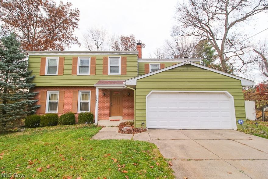 Great home in the Revere School District.  Close to I77, Fairlawn, shopping, Sand Run, and Cuyahoga Valley National Park.  Hardwood floors throughout, with an open floor plan.  1/2 bath in the basement and on the main floor.  Two full baths up.  Master bedroom with wall of windows to enjoy nature.  The kitchen boasts beautiful maple cabinets and character that flows into the family room with a brick fireplace and sliding glass doors that open onto a deck. The walkout basement that opens to a limestone patio is just waiting to be finished or not-you choose!  Big backyard with a shed for extra storage.   Two car attached garage.  Schedule your showing today. New washer and refrigerator in 2021, Garbage disposal 2020, Range 2019, Dishwasher 2016, and microwave 2018. New roof and replacement windows in 2012.