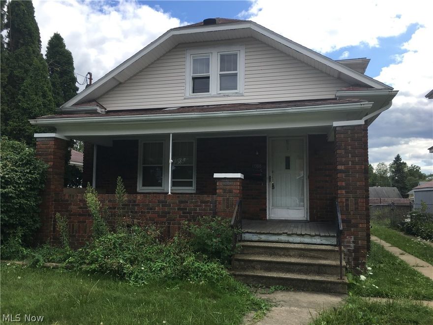 Currently an investment and tenant occupied. This bungalow could either be your next investment or your next home! Two bedrooms on the main floor, eat in kitchen, dining room and living room. Living room does closed up fireplace not currently in use. Hardwood floors throughout the home. The upstairs has two bedrooms and full bathroom.