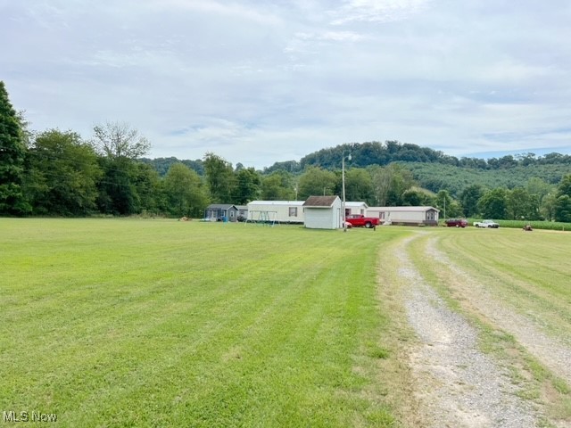 This property is a great investment opportunity. It is 3.6 level acres with 4 mobile home lots. The total current monthly lot rent income is $920.00 with room to be increased. There is 1 well and 2 septic systems that have been approved by the health department.