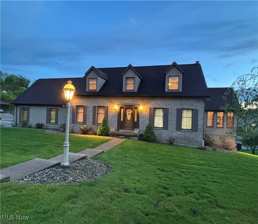 New Price!!! Welcome to this outstanding brick front home with stone landscaping, attractive curb appeal and many quality updates!  Featuring 4 bedrooms, 3.5 bathrooms on a corner lot with cul-de-sac and in a wonderful neighborhood. A level lot allows for a large driveway for parking and a walkway to rear stairs make it assessable to the upper spacious new composite deck for entertaining. Enter the home through a beautiful wood/glass side panel front door to a tiled foyer with beautiful chandelier, and coat closet.  The dining room and living room each bring in lots of natural light. The eat in kitchen has a tiled floor with loads of cabinets and pantry. The counters and island have granite tops and there is custom tiled backsplash. You can entertain in the adjoining  family room with cozy fireplace and a walk out to the spacious rear deck.  You'll love the beautiful sunroom with tile floor and surrounding windows for relaxing morning coffee and reading. Walk up the beautiful staircase to an upper foyer and enter the primary en-suite bedroom with 2 walk ins plus additional closet.  The bath has a soaker jetted tub, separate shower, double sink and linen closet. There is a Jack and Jill full bathroom between the 2 guest bedrooms. A mudroom off the garage is great for dropping off your pantry items and has a desk. The lower level In-law suite or Accessory dwelling unit consists of a living room, eat in kitchen with all appliances, bedroom, office and new full bath. Additional storage areas in lower level.  Laundry room has side sink and space to sort or store items. Walk in/out to lower covered patio with 3 new doors.   The oversized two car garage has an inset for lawn equipment or tools and lots of storage. Don't miss out!! Schedule your appointment today!!