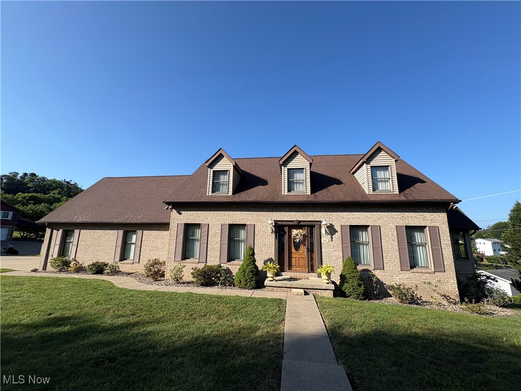 New Price!!! Welcome to this outstanding brick front home with stone landscaping, attractive curb appeal and many quality updates! Featuring 4 bedrooms, 3.5 bathrooms on a corner lot with cul-de-sac and in a wonderful neighborhood. A level lot allows for a large driveway for parking and a walkway to rear stairs make it assessable to the upper spacious new composite deck for entertaining. Enter the home through a beautiful wood/glass side panel front door to a tiled foyer with beautiful chandelier, and coat closet. The dining room and living room each bring in lots of natural light. The eat in kitchen has a tiled floor with loads of cabinets and pantry. The counters and island have granite tops and there is custom tiled backsplash. You can entertain in the adjoining family room with cozy fireplace and a walk out to the spacious rear deck. You'll love the beautiful sunroom with tile floor and surrounding windows for relaxing morning coffee and reading. Walk up the beautiful staircase to an upper foyer and enter the primary en-suite bedroom with 2 walk ins plus additional closet. The bath has a soaker jetted tub, separate shower, double sink and linen closet. There is a Jack and Jill full bathroom between the 2 guest bedrooms. A mudroom off the garage is great for dropping off your pantry items and has a desk. The lower level In-law suite or Accessory dwelling unit consists of a living room, eat in kitchen with all appliances, bedroom, office and new full bath. Additional storage areas in lower level. Laundry room has side sink and space to sort or store items. Walk in/out to lower covered patio with 3 new doors. The oversized two car garage has an inset for lawn equipment or tools and lots of storage. Don't miss out!! Schedule your appointment today!!