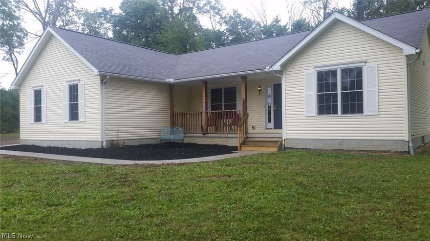 Move-in ready ranch in SouthEast school system. Split master floorplan features master suite with walk-in closet and master bath with tub, shower and double vanity sink. Spacious kitchen has Merillat cabinetry with island and features cathedral ceiling. Living room overlooks deck at back of house. 
Cute front porch overlooks new sidewalk and landscaped area. Carpet replaced 8/16. Full basement with poured wall foundation
Oak trim and Andersen windows throughout.
Minutes to shopping in NewtonFalls.