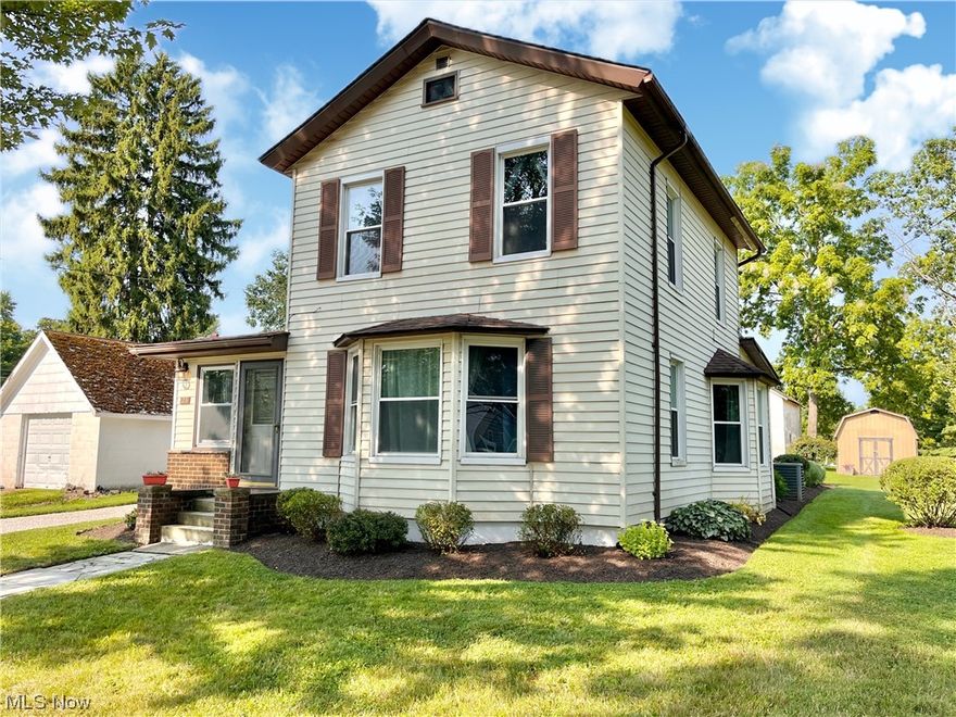 Nestled in the heart of the picturesque Village of Seville, this home at 23 Warner Street presents a rare opportunity to embrace a serene and comfortable lifestyle. Through the front door you'll find a small room with wood burning stove which could be used as a sitting area or an office space. The first floor layout is perfect for entertaining with the living room, dining room & kitchen all flowing together seamlessly. Convenient first floor laundry, mudroom and half bath complete the main level. The redesigned kitchen features a custom tile backsplash, durable laminate scratch resistant flooring, hickory cabinets & newer stainless steel appliances. The living room and dining room have large bay windows creating a bright and inviting atmosphere with their natural light throughout the day. On the second level you'll find 3 bedrooms, a full bath and a large open hallway. Outside you'll find a spacious backyard and a large patio. Perfect for outside entertaining, gardening, and endless pl