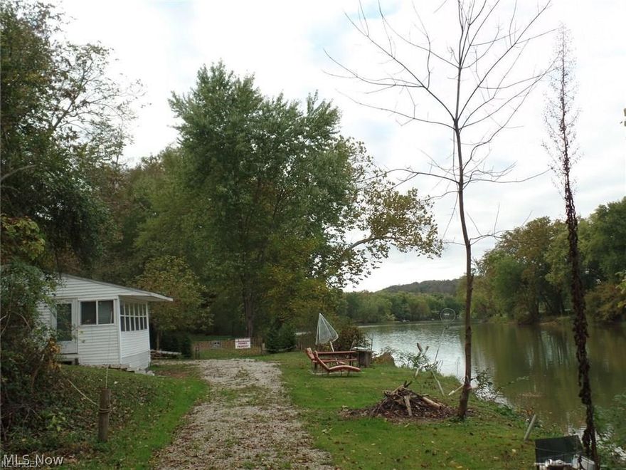 Perfect riverfront get-a-way! Handyman special. This cottage along the Muskingum River is perfect for weekend get-a-ways, the beautiful riverfront views you can spend your days fishing and boating. The owner is including the paddle boat!
